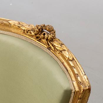 A Louis XVI-style arm chair, ca 1900.