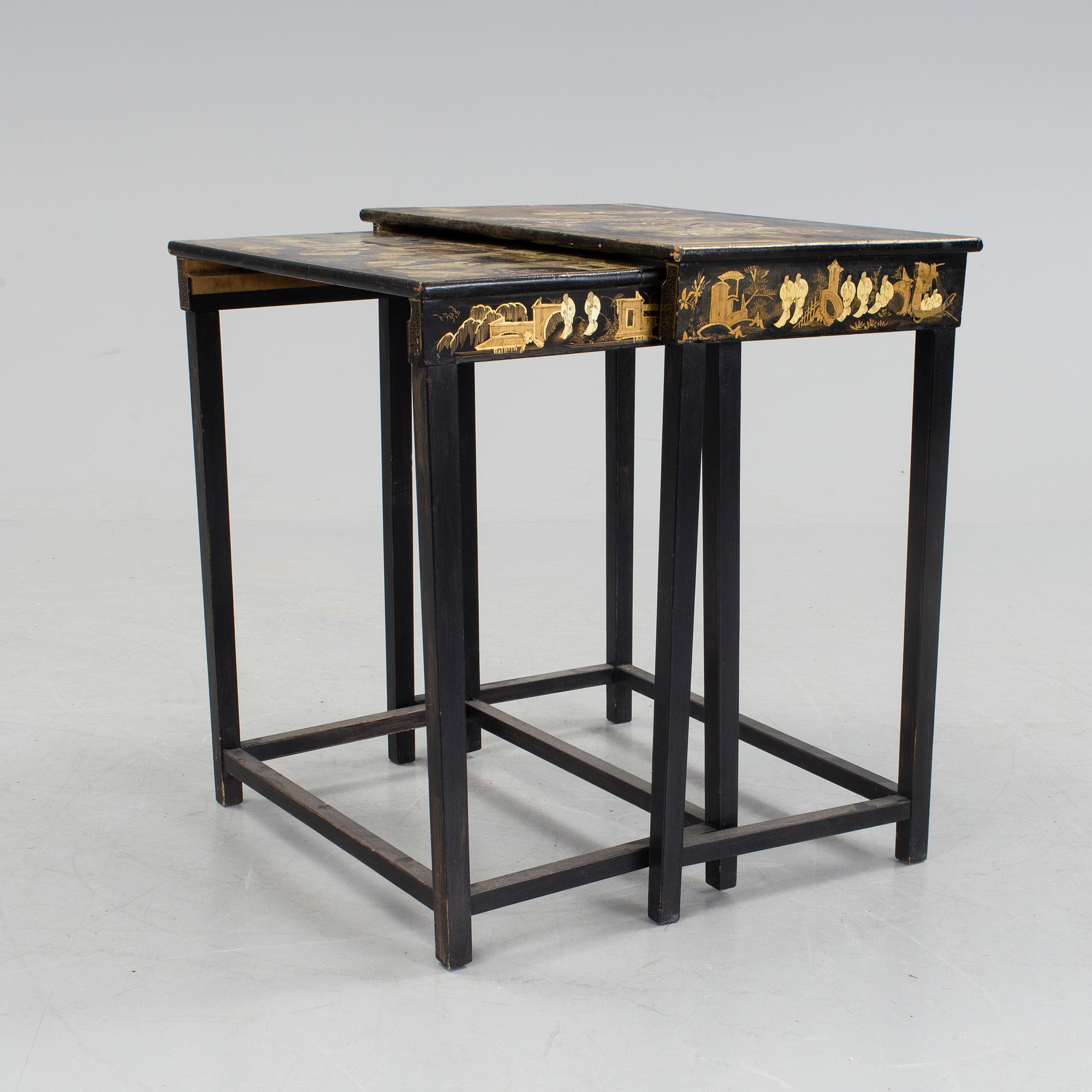 A set of two stacking tables with oriental motif, early 20th century.