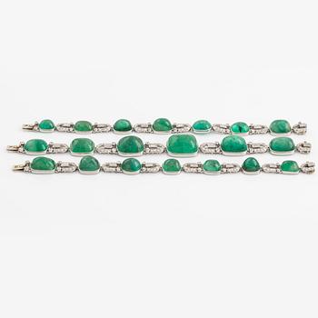 An art deco platinum necklace/bracelet combination with cabochon-cut emeralds.