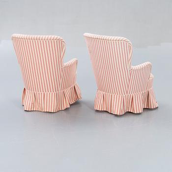 A pair of Modern easy chairs.