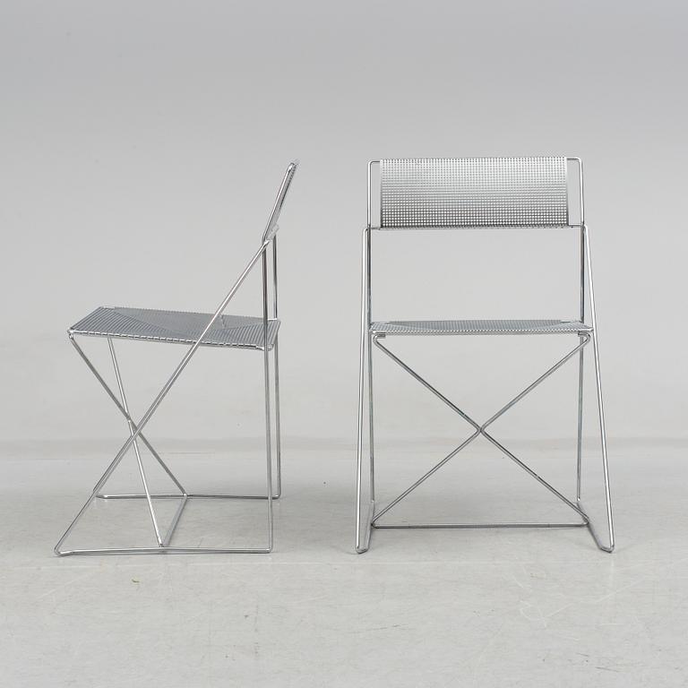 8 contemporary stackable metal chairs.