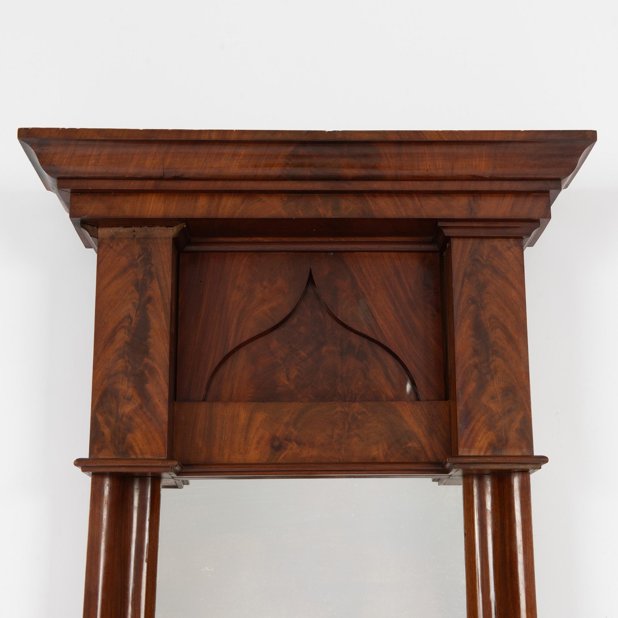 An Empire mirror, first half of the 20th Century.