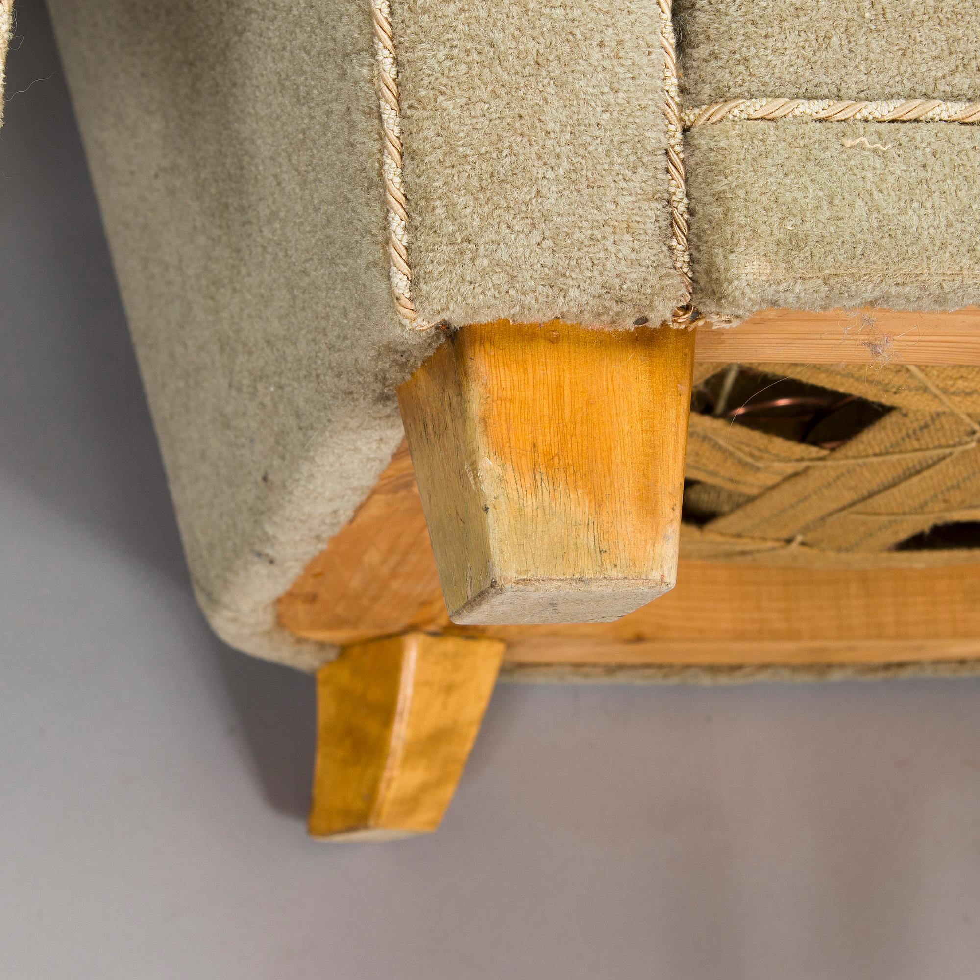 A pair of mid-20th century armchairs.