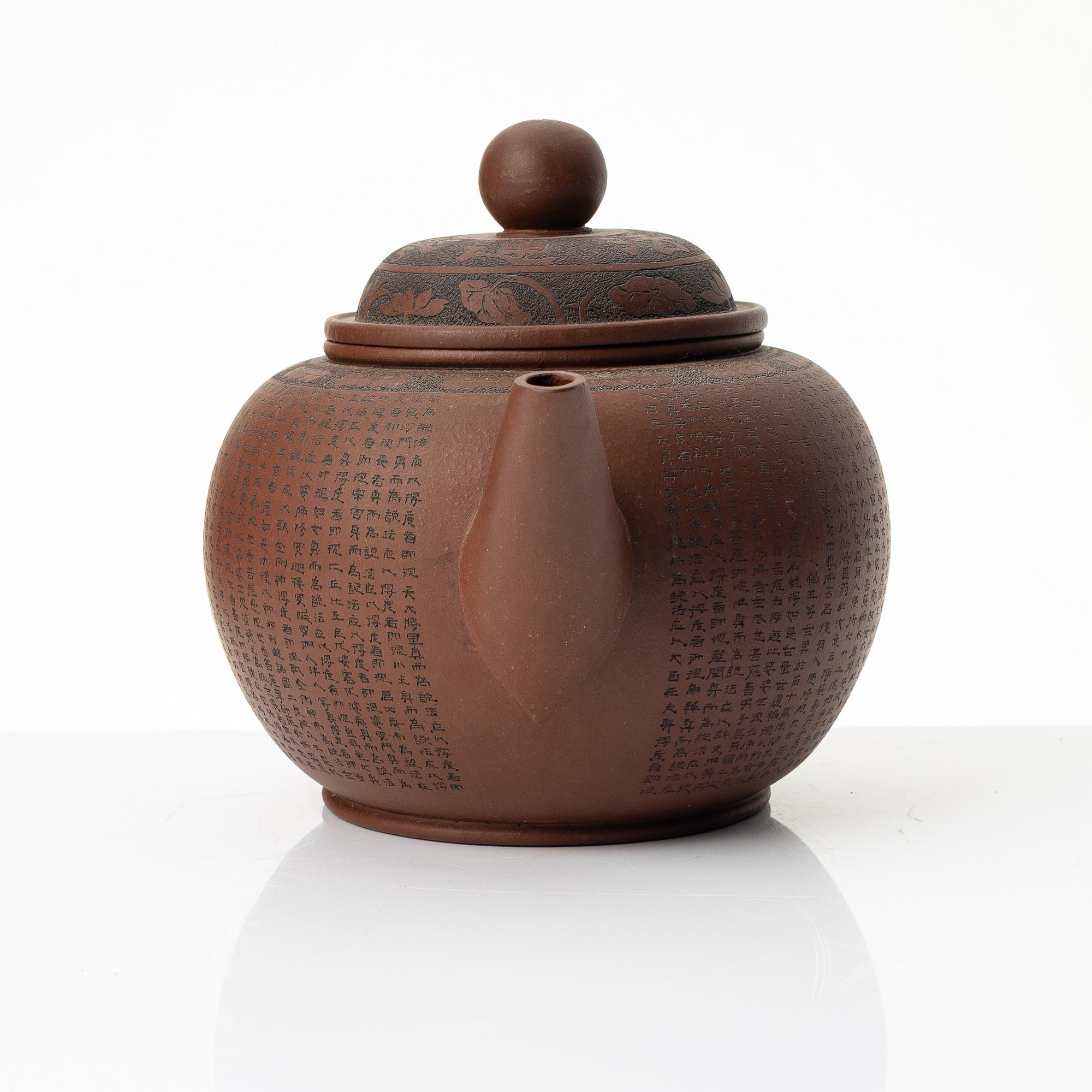 A 'calligraphy' yixing teapot, China, later part of the 1900s.