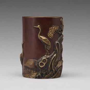 A bronze brush pot, Qing dynasty, with Qianlong seal mark to base.