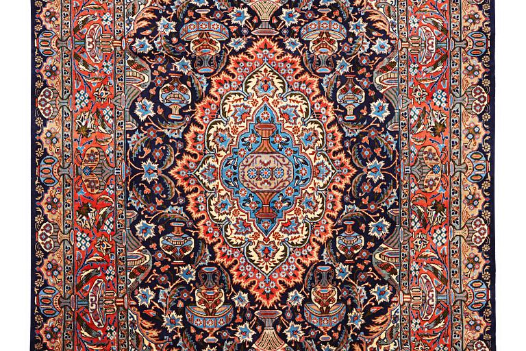 A Kashmar carpet, c. 310 x 203 cm.