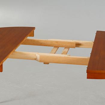 A dining table made in the middle of the 20th century.