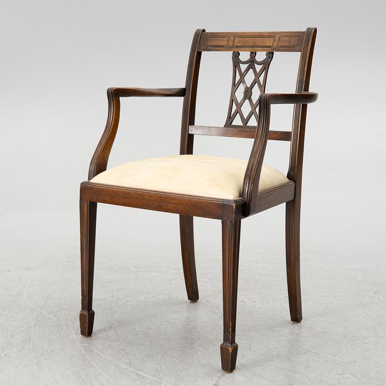 A mahogany and mahogany veneer desk with desk chair, 20th Century.