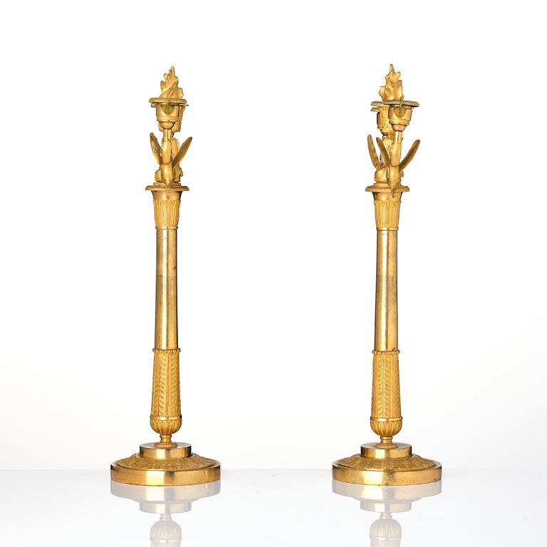 A pair of ormolu three-branch Empire candelabra, early 19th century.