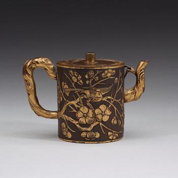 A gilt copper alloy teapot with cover, Qing dynasty, presumably 18th Century.