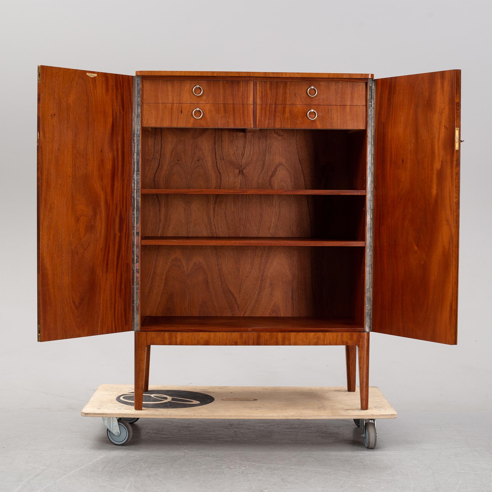 A 1940's Swedish Modern mahogany cabinet from Möbelbolaget.