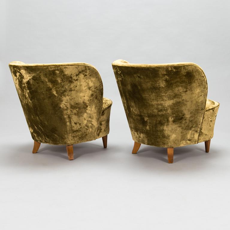 A pair of mid-20th-century armchairs.