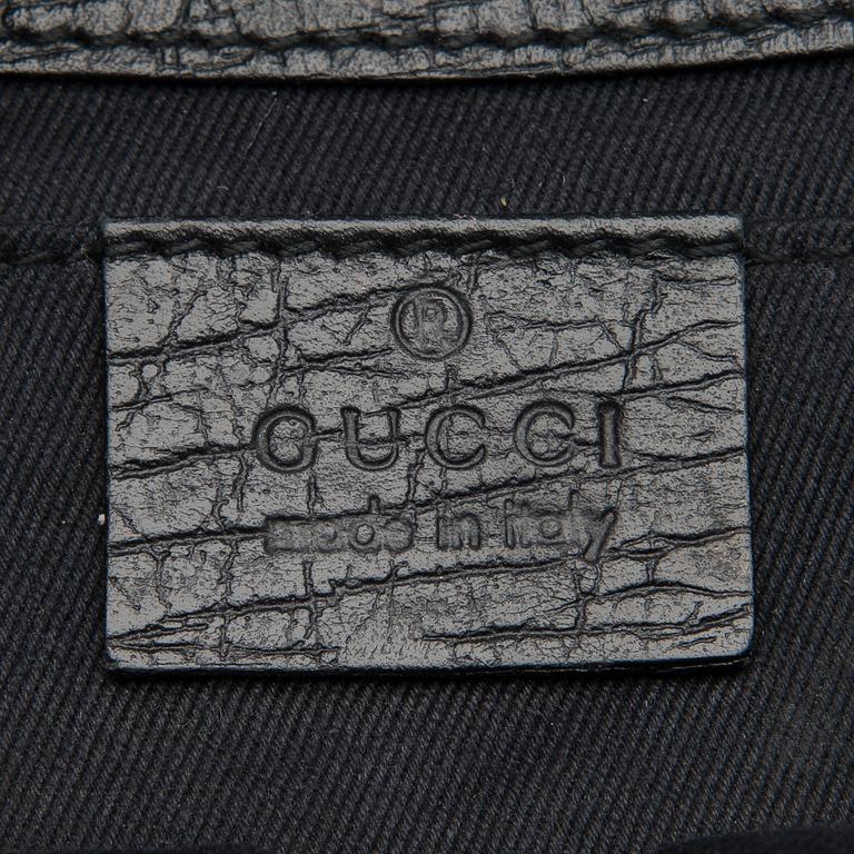A Black GG Canvas Horsebit Clutch.