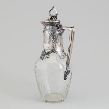 An Art Nouveau claret-jug, glass and silver plated metal, possibly Germany, c. 1900.