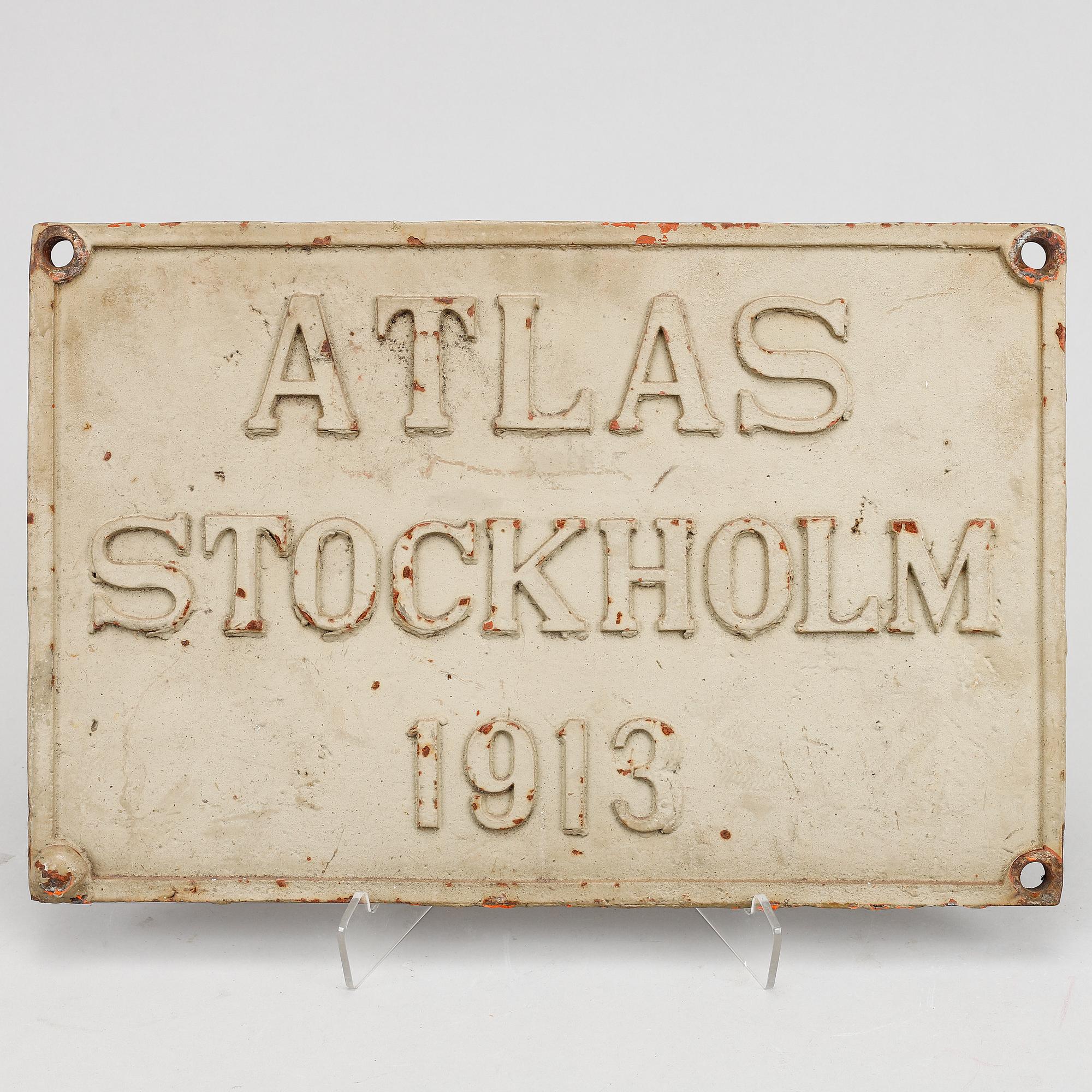 An iron sign,  "Atlas Stockholm 1913".