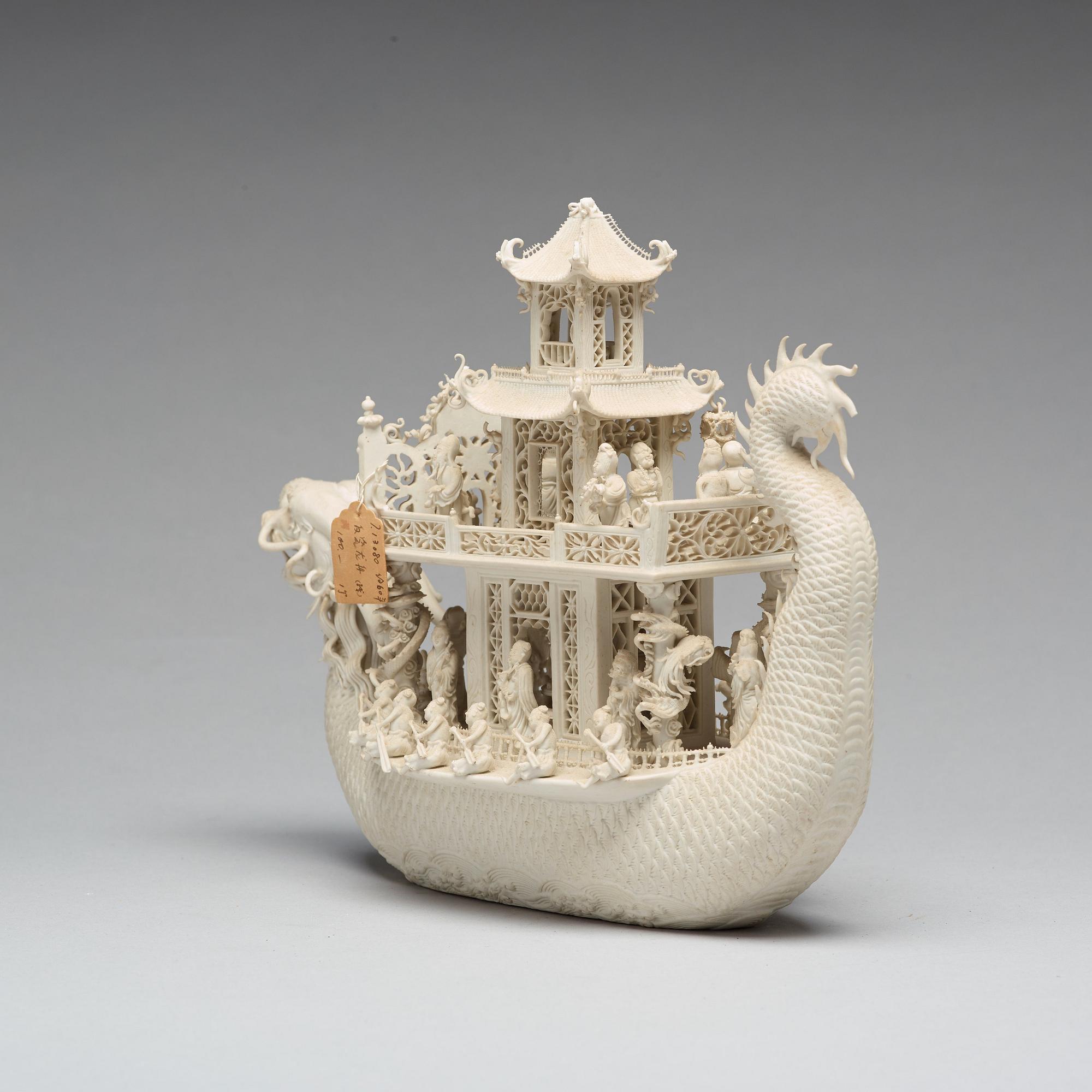 A biscuit porcelain dragon boat of 'Assembly of Immortals', Qing dynasty, Daoguang, signed Chen Guozhi, 19th century.