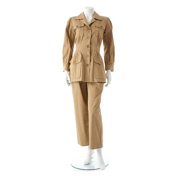 YVES SAINT LAURENT,a two-piece beige cotton dress consisting of jacket and pants, from the Safari collection s/s 1968.