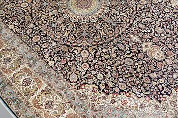 An oriental silk carpet, c. 297 x 202 cm.