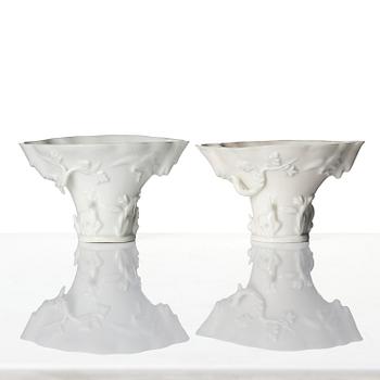 A pair of blanc de chine rhinoceros libation cups, Qing dynasty, Kangxi (1662-1722).