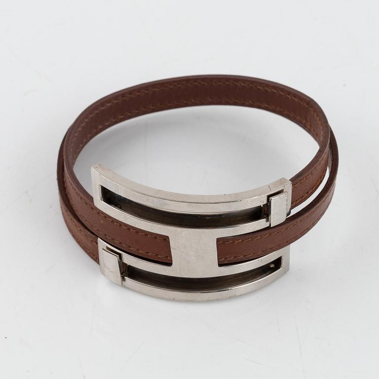 Hermès, a brown leather and palladium metal 'Pousse Pousse' bracelet.