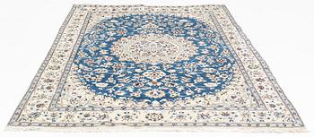 A Nain carpet, circa 310 x 196 cm.