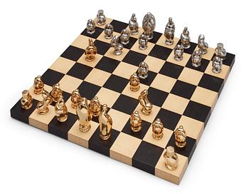 345. A set of chess; 32 pewter and pacel gilt pewter,  by Svensk Tenn.