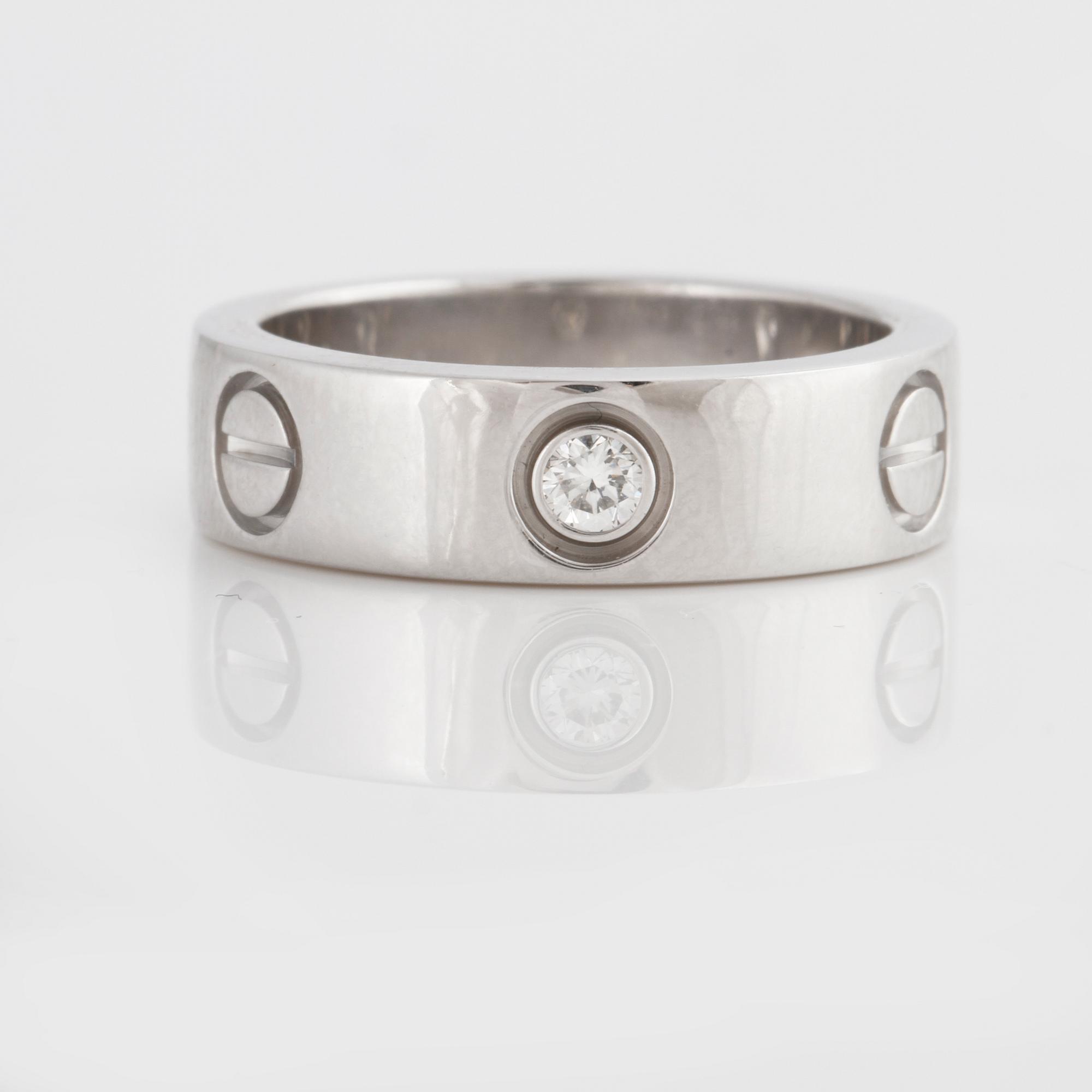 A brilliant-cut diamond "Love" Cartier ring.