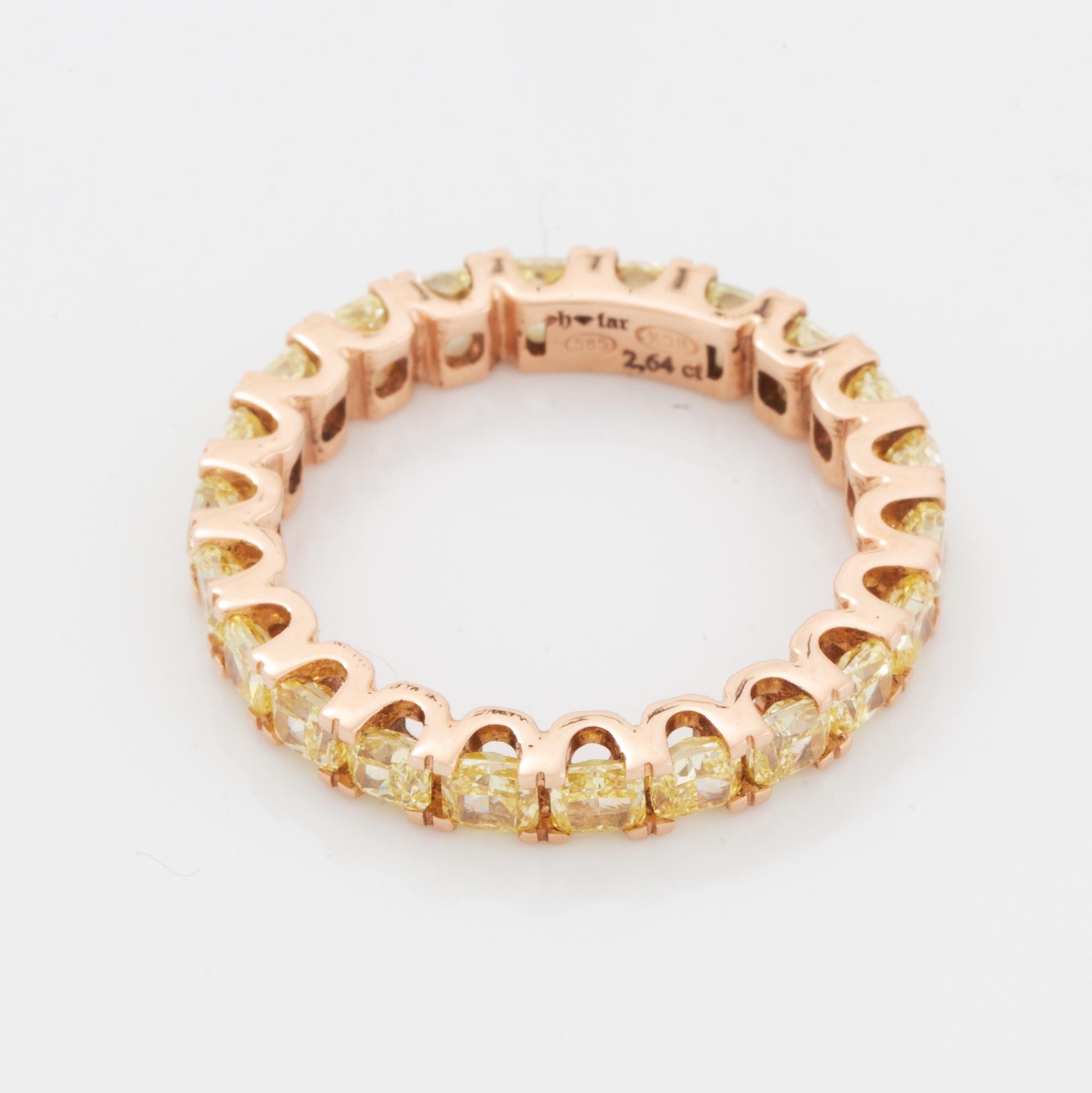 Cushion-cut yellow diamond eternity ring.