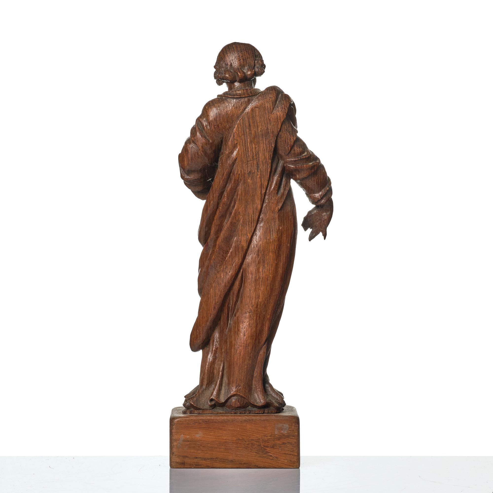 An oak sculpture of the apostle Luke, 18th/19th century.
