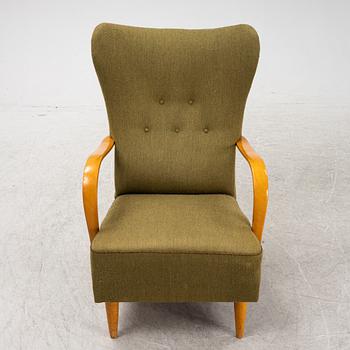 A 1940's wingback armchair.