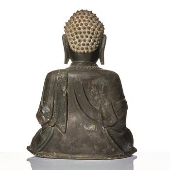 A large bronze sculpture of Shakyamuni Buddha, Ming dynasty (1368-1644).