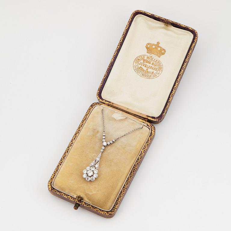 A platinum necklace set with old- and eight-cut diamonds.