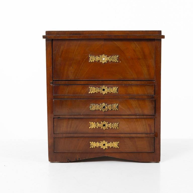 A Swedish Empire mahogany minature commode, first part 19th century.