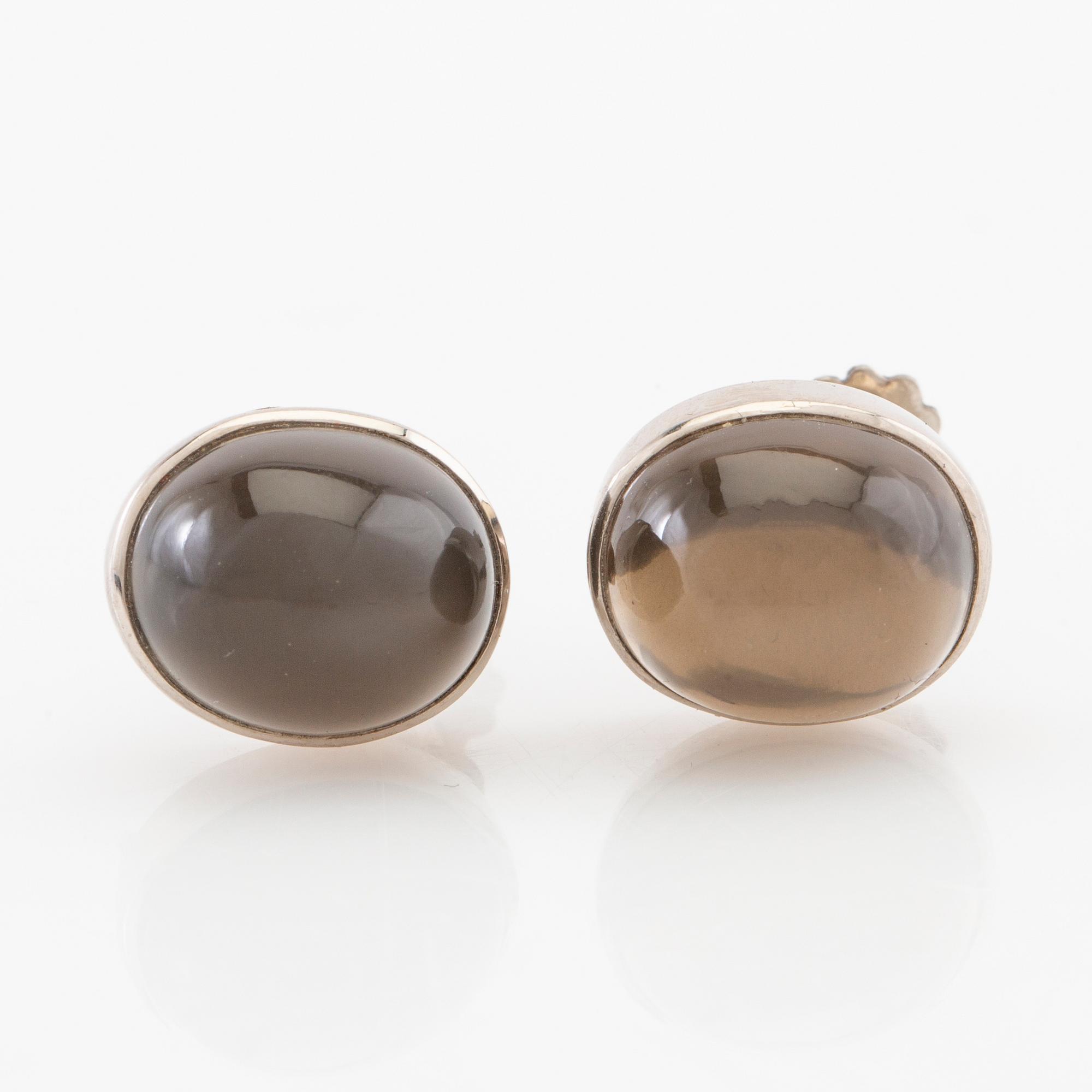 Earrings, a pair of 18K white gold with cabochon-cut grey moonstones, Gunnar Fahlström, Stockholm 1955.