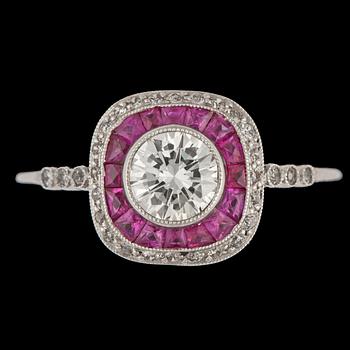 1085. A brilliant cut diamond ring, tot. 0.63 cts, set with small rubies.