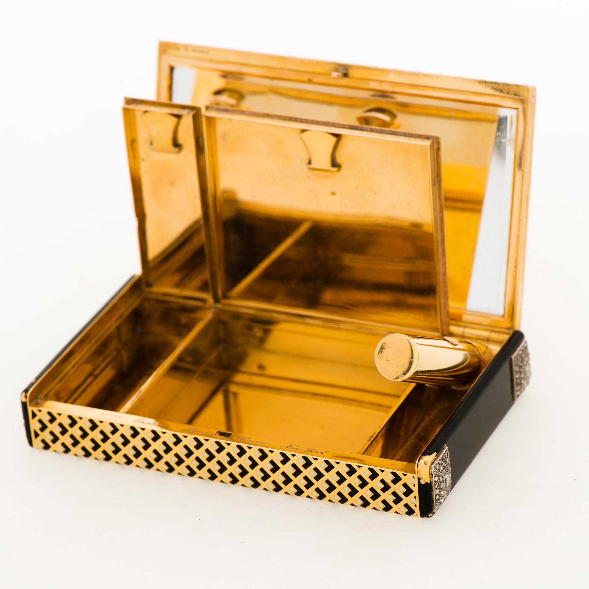 Cartier Art Deco Vanity Case 18K guld med svart emalj och baguette- och rosenslipade diamanter.