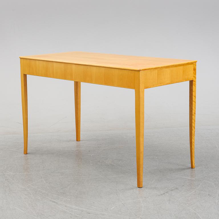 A 'Nya guldheden' desk by Carl Malmsten.