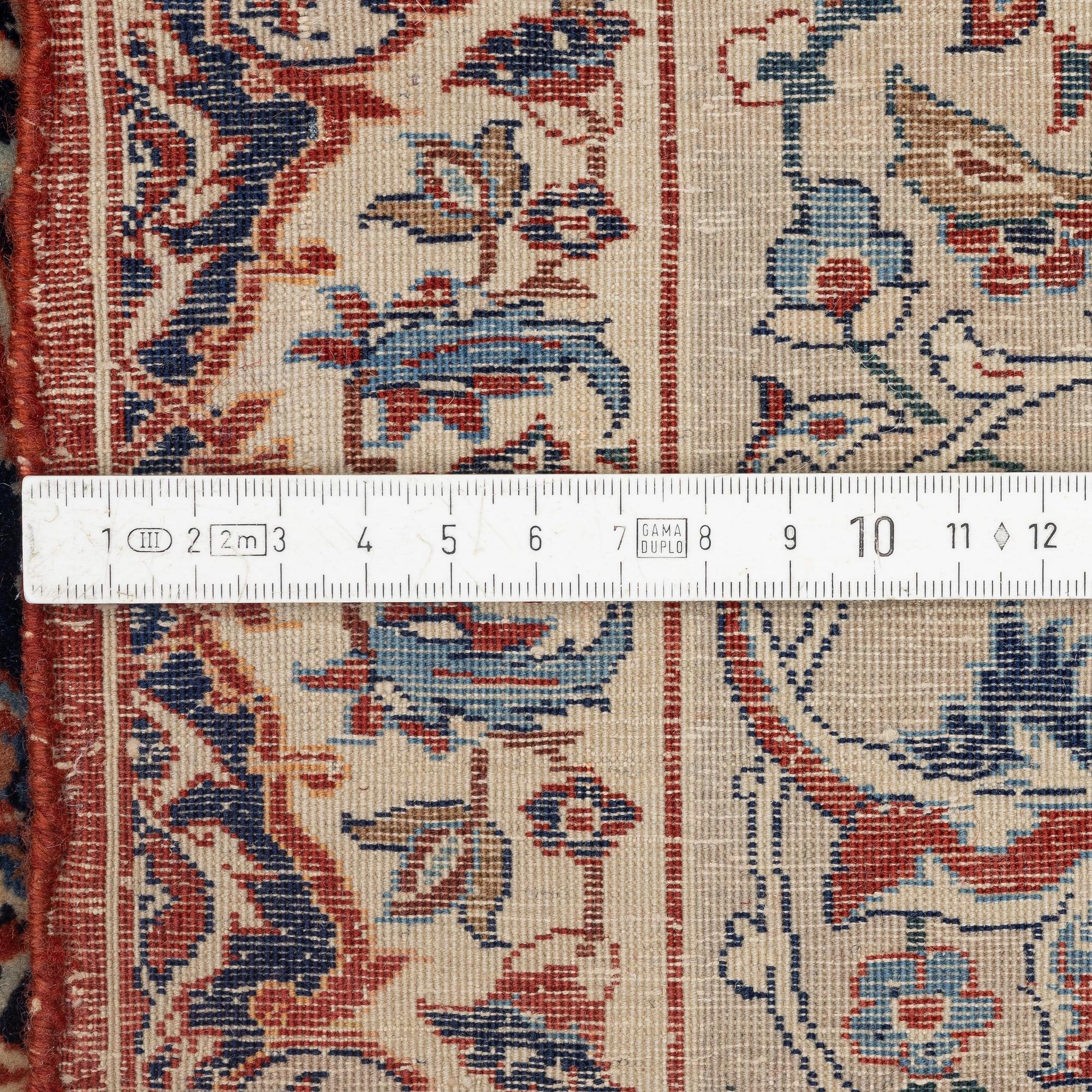A semi-antique Isfahan rug, signed (Sadegh) Seirafian, c. 244 x 149 cm.