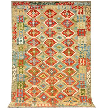 An Afghan Kilim carpet, c. 305 x 200 cm.