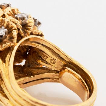A WA Bolin ring in 18K gold set with round brilliant-cut diamonds.