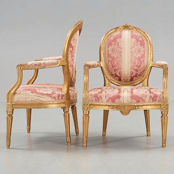 A matched pair of Gustavian late 18th cenury armchairs.