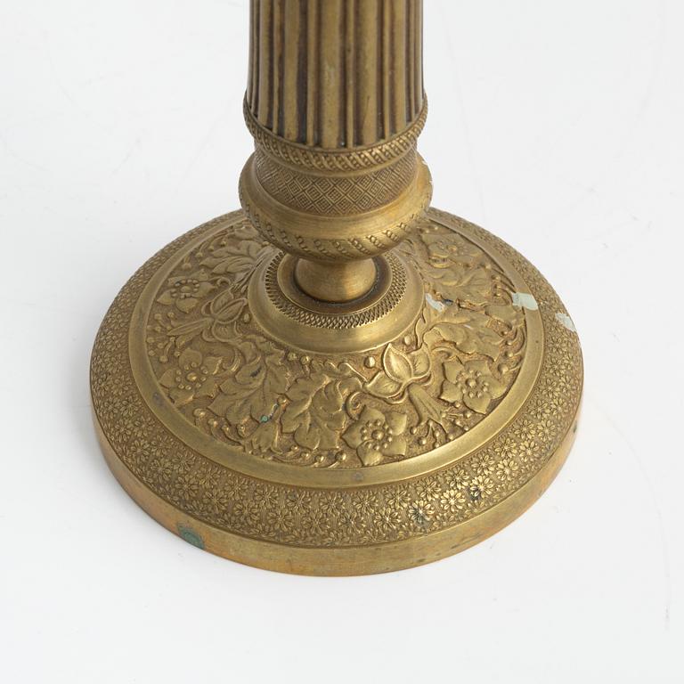 A brass Empire candlestick, first half of the 19th century,