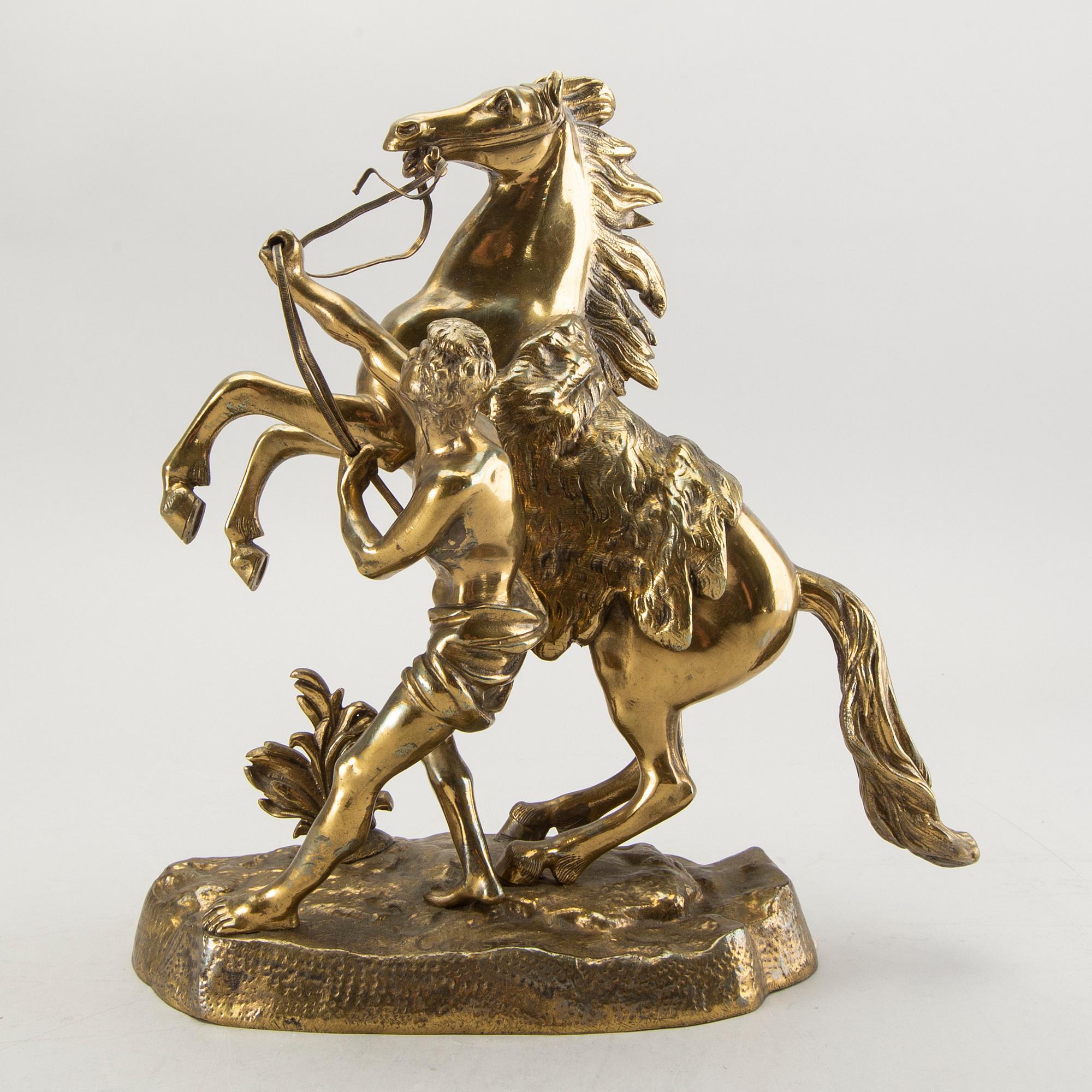 A bronze sculpture after Guillaume Coustau.