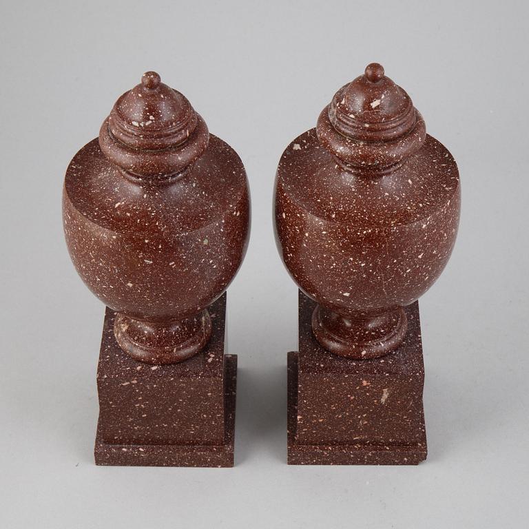 A pair of porphyry urns, presumably first half 20th century.