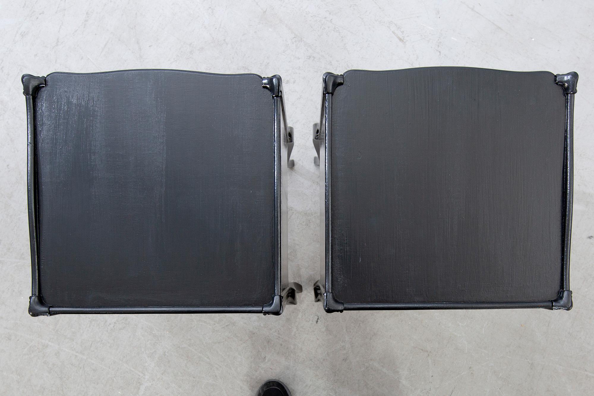 A pair of Rococo-style bedside tables later part of the 20th century.