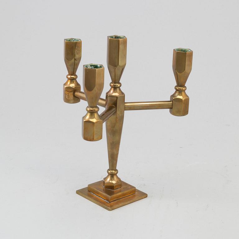 a brass candelstick from Gusum, 20th century.