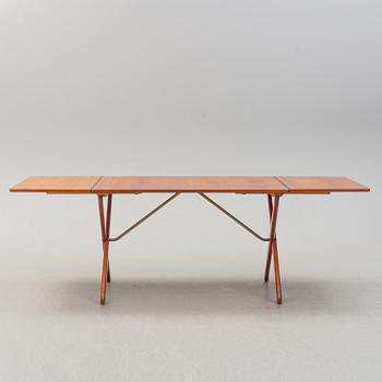 A teak veneer and stained beech dining table, mid 20th Century.