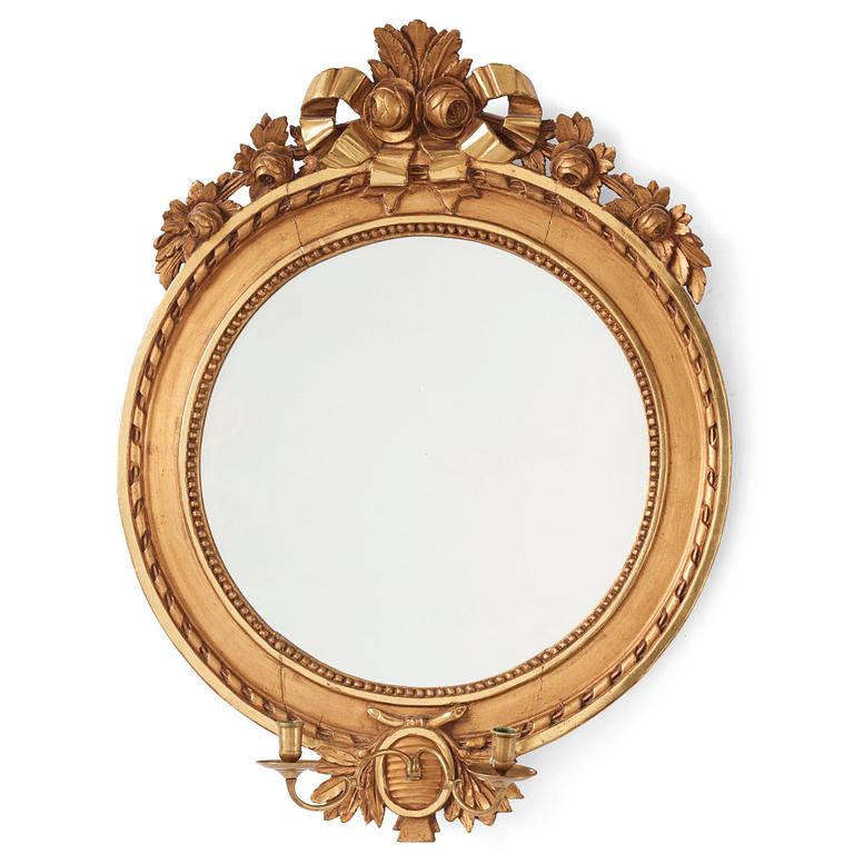 A Gustavian two-light girandole mirror.