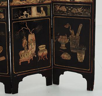 An eight panel lacquer screen, Qing dynasty, presumably Kangxi (1662-1722).