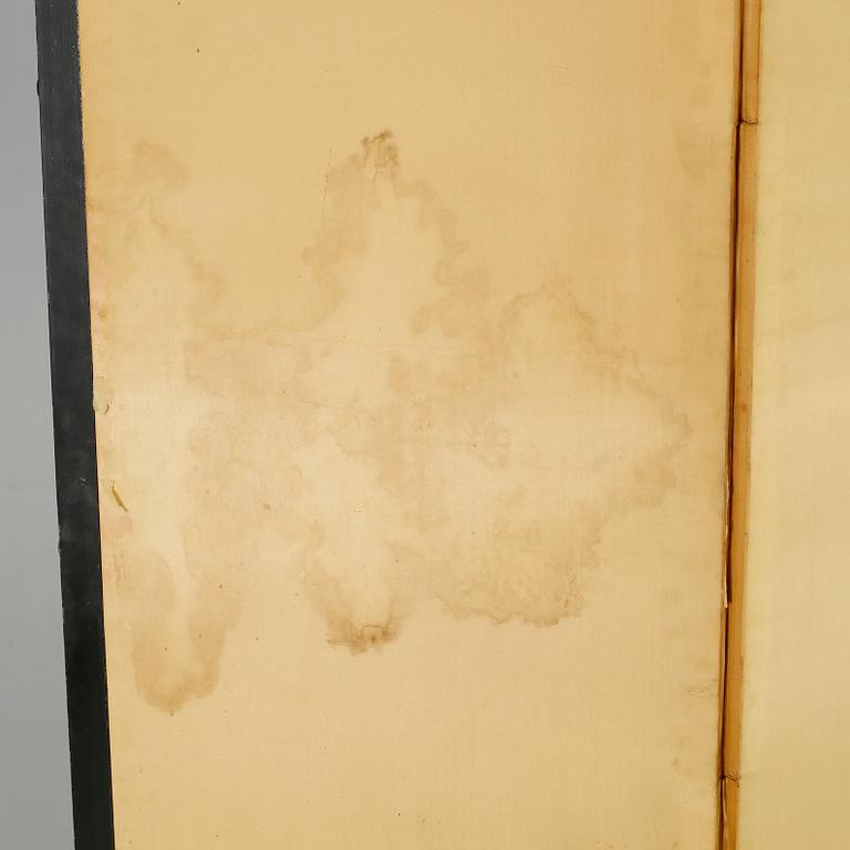 A 20th century folding screen.